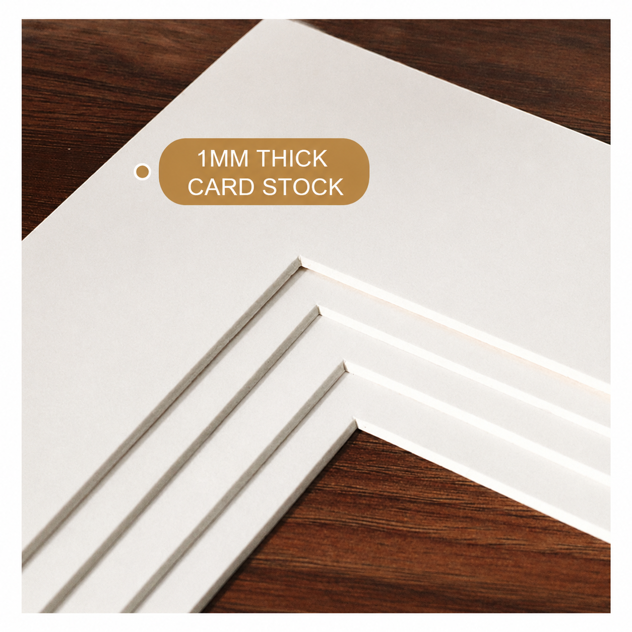 Premium 1mm thick white matte card stock stack on warm walnut wood surface