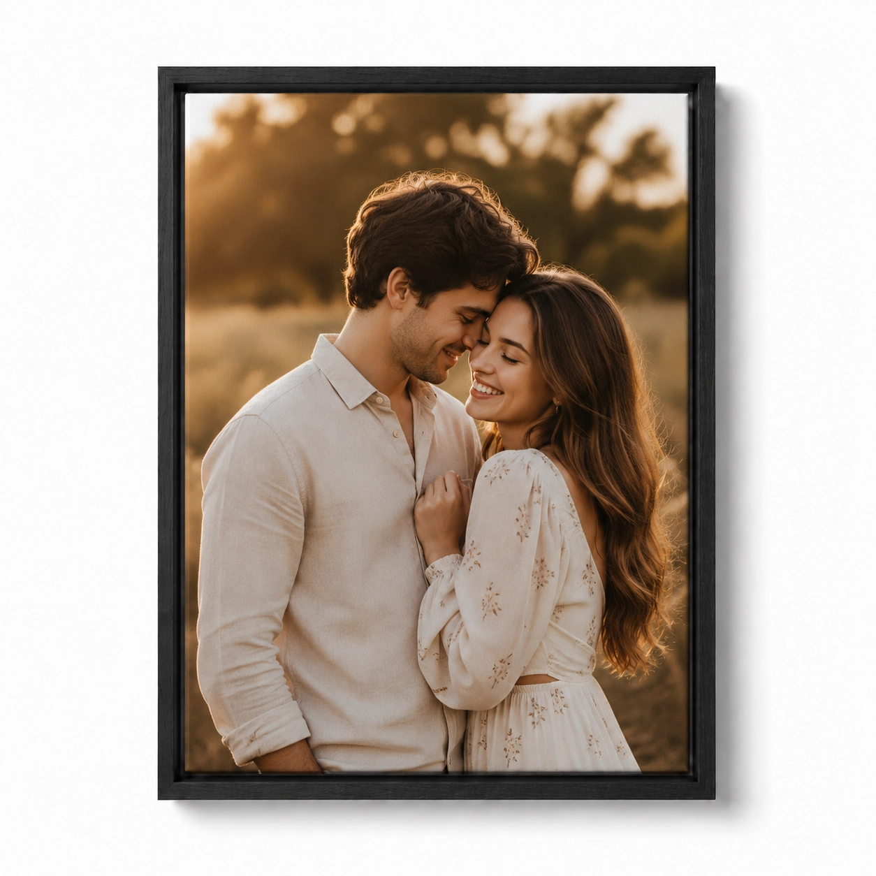 Personalized black floating-frame canvas print of a romantic couple embracing at golden hour.