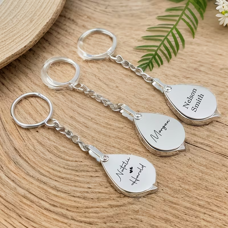 Personalized folding silver magnifying glass keychain, a custom engraved gift