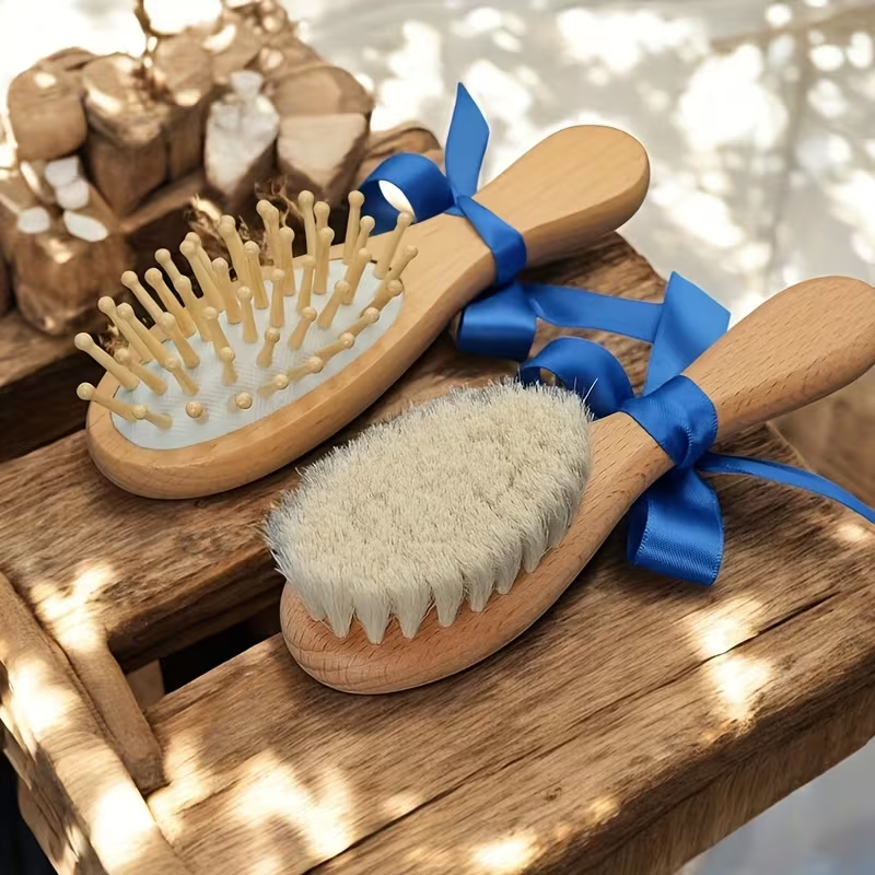 Personalized 3-piece wooden baby brush and comb set with blue satin ribbon